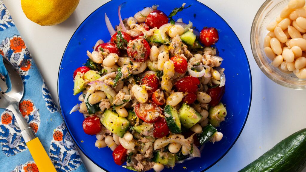 Stanley Tucci tuna bean salad in a bright blue serving bowl.