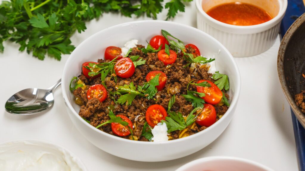 Anna Paul viral Turkish pasta dish in a white bowl.
