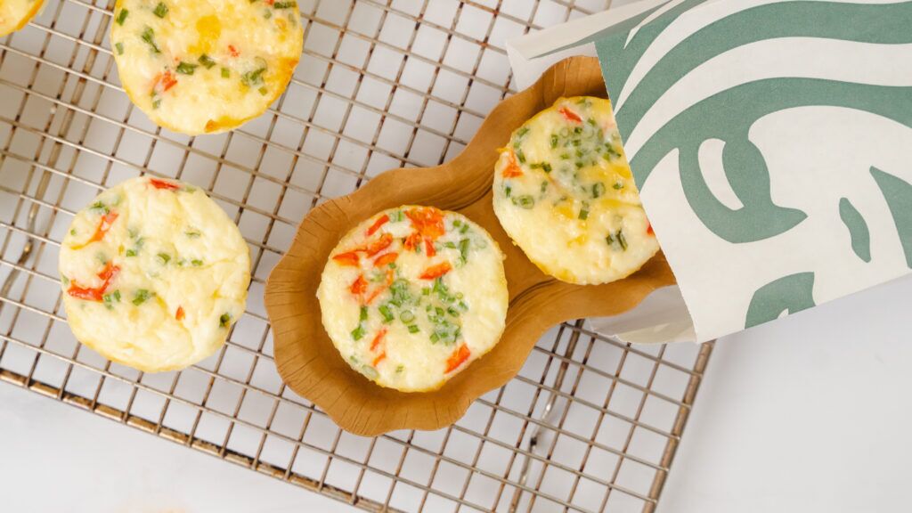 Starbucks egg butes recipe with egg bites sitting on a a cooling wire rack.