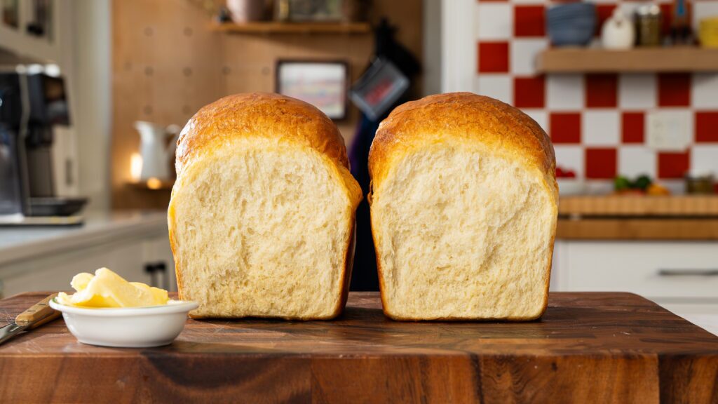 A protein bread recipe worth check out: two loaves of protein bread in a cutting board.