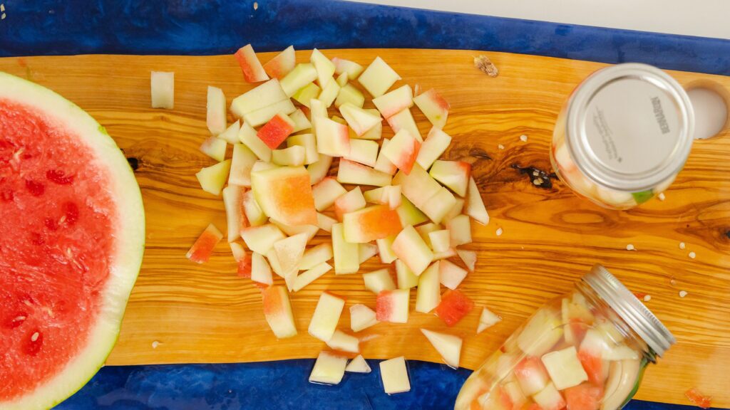 Watermelon rind being diced up to make a pickled watermelon rind recipe.
