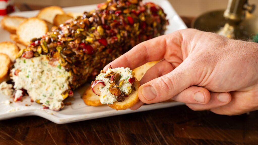 Taking a bite out of a festive cheese ball.