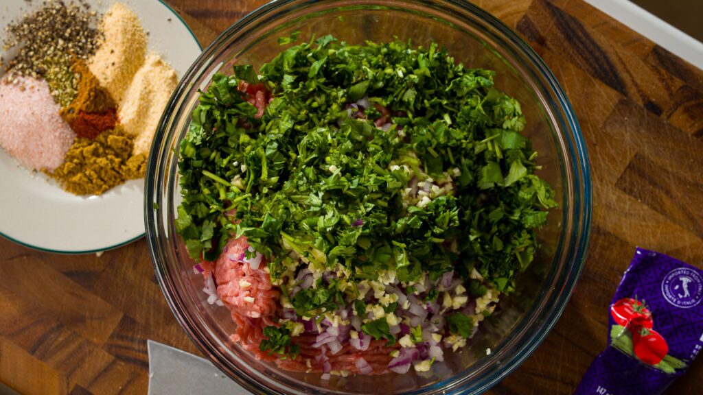 Chicken kebab recipe ingredient in a large mixing bowl.