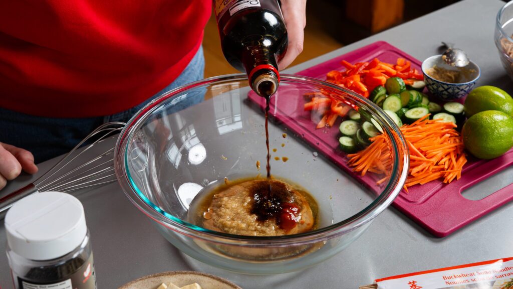 Making a soba noodle salad dressing.