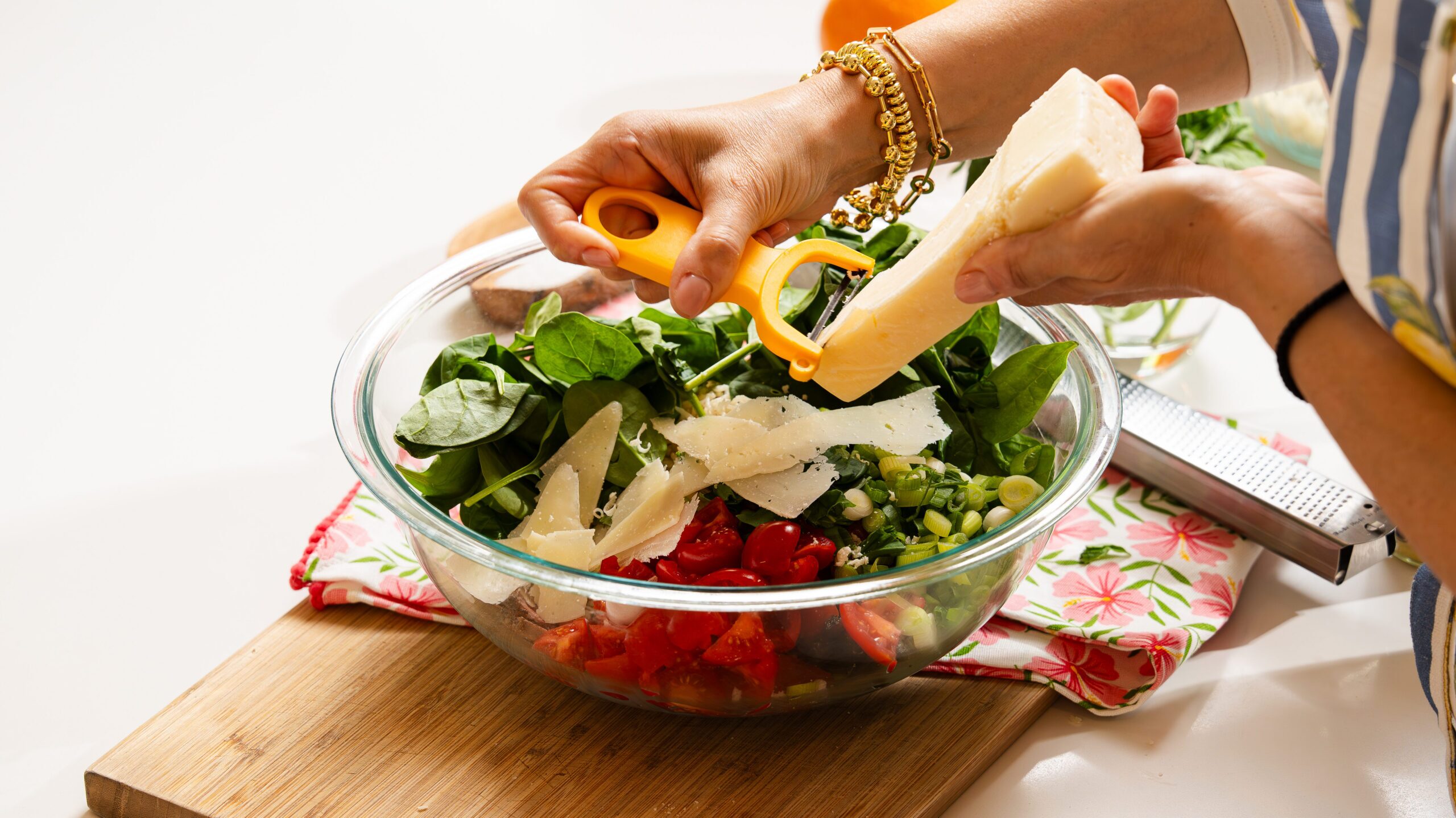 Shaving cheese into a delicious steak salad.