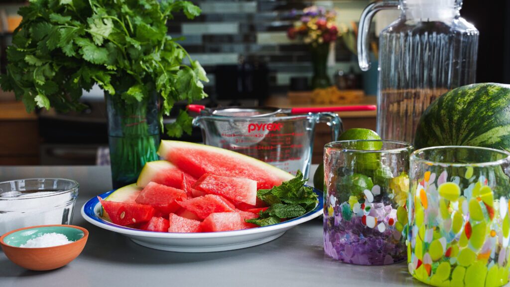 Watermelon agua fresca ingredients on a counter.