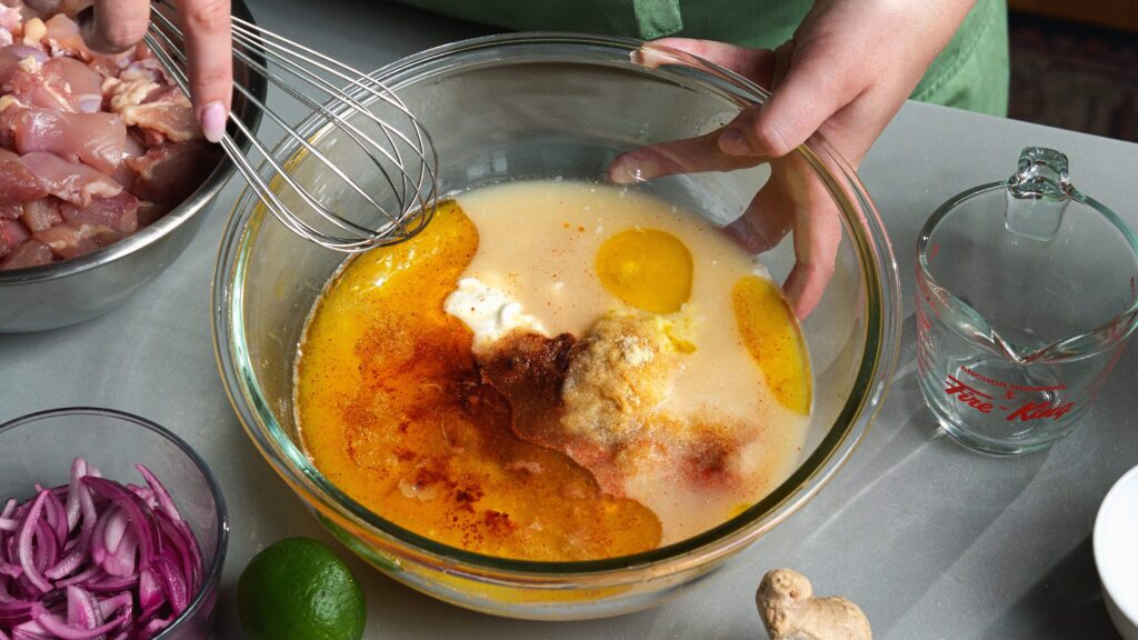 Mango chicken marinade in a mixing bowl.