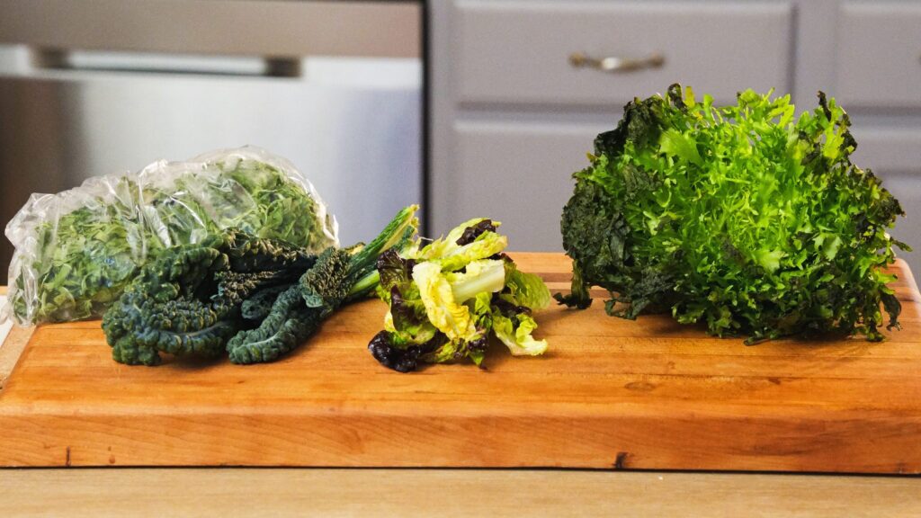 Can you freeze shredded lettuce? Varieties of lettuce on a cutting board.