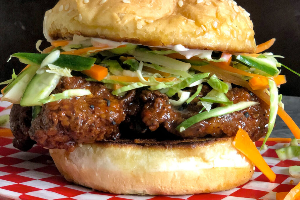 A close up of a Korean Fried Chicken Sandwich