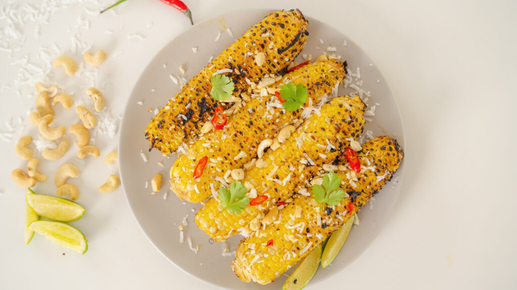 Thai Grilled Corn served in a shallow white bowl