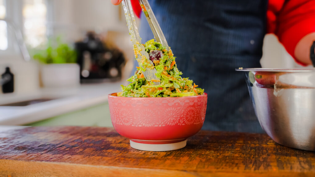 Crunchy Curry Chop Salad in a red bowl.