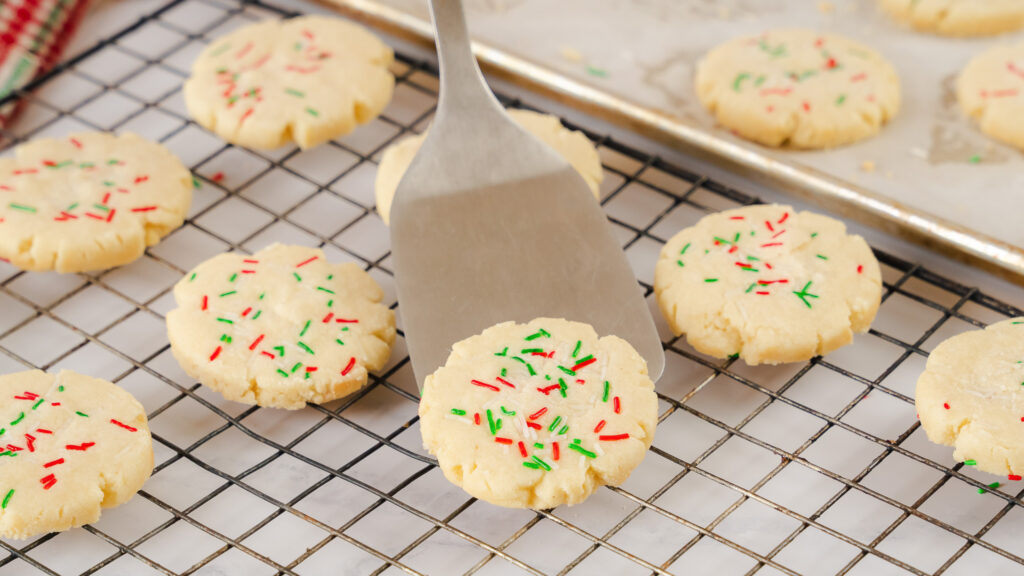 A close up shot of 3 Ingredient Sugar Cookies cooling on a wire rack.