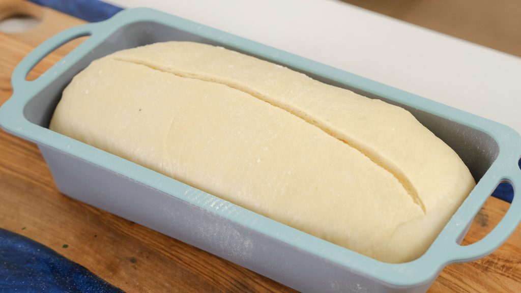 A close up shot of an unbaked loaf of protein bread. 