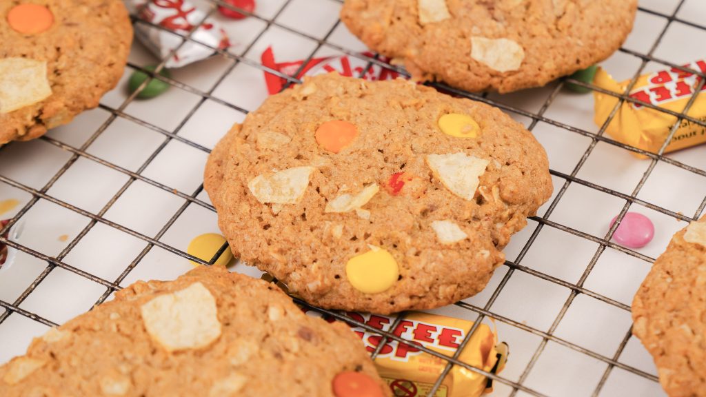 Monster Cookies cooling in a wire rack. 
