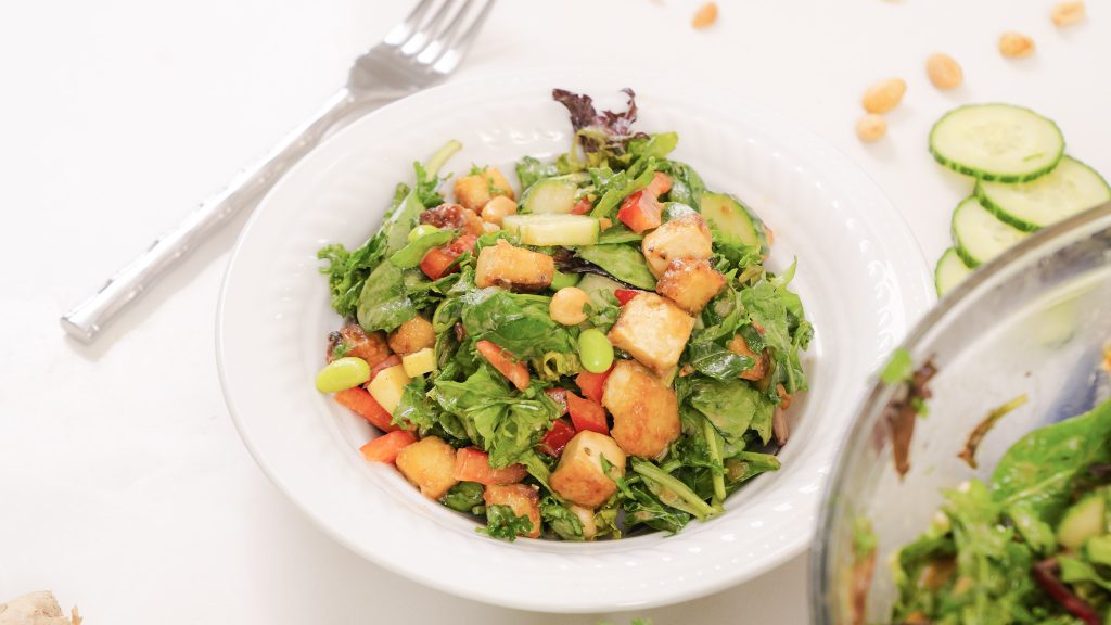 Crispy Tofu and Ginger Lime Salad in a white china bowl.