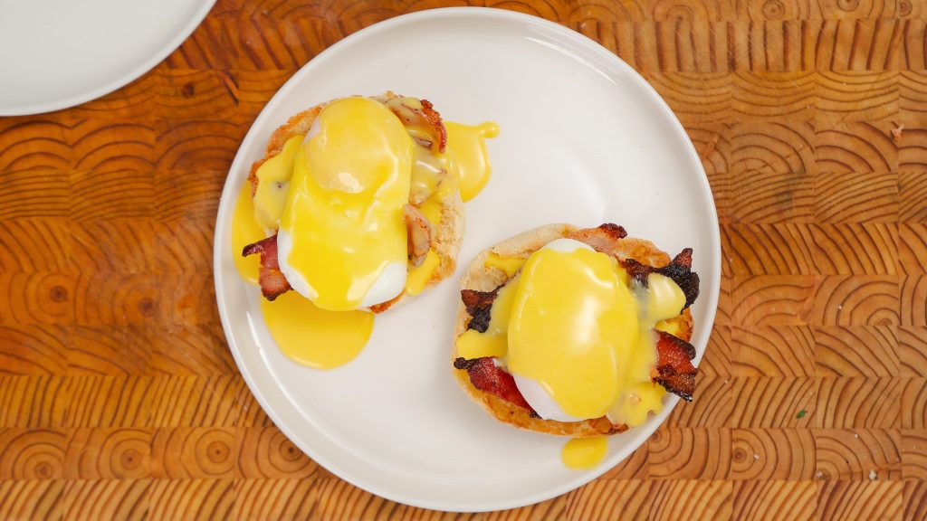 Two fully dressed eggs Benedicts.  