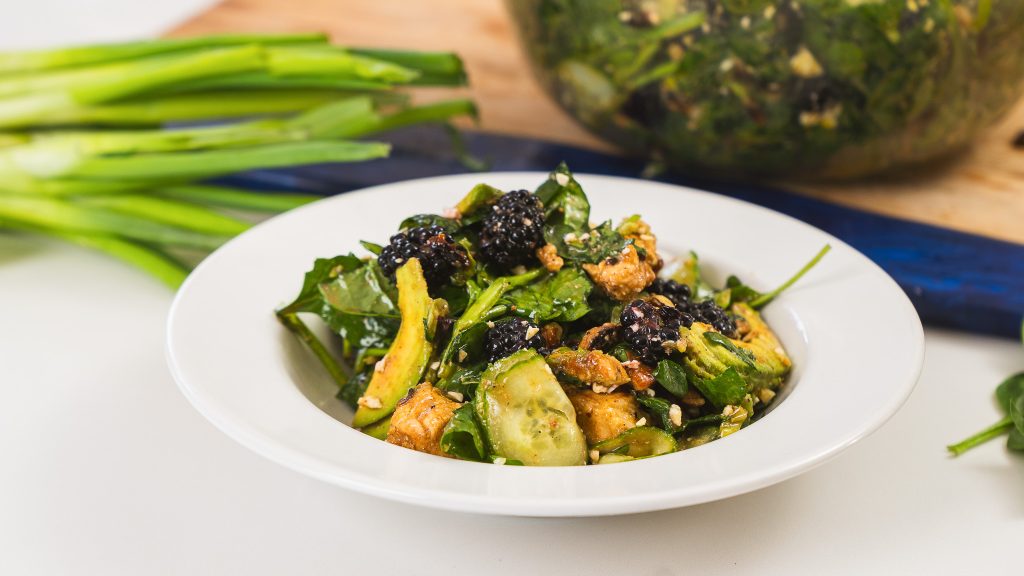 A close up shot of Blackberry Walnut Avocado Salad.