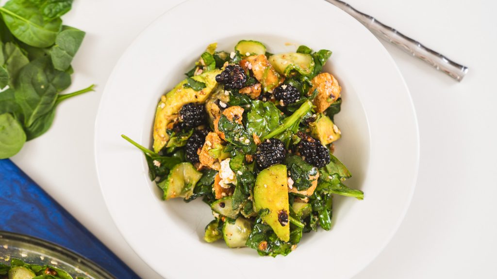 A close up shot of Blackberry Walnut Avocado Salad.