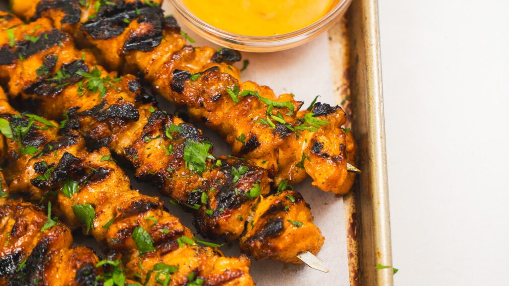 cooked close up of bang bang chicken skewers