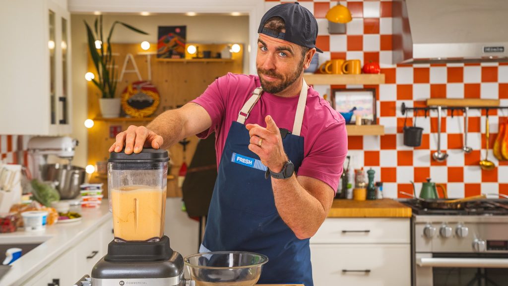 Andy Hay hand on blender wearing Fresh Apron