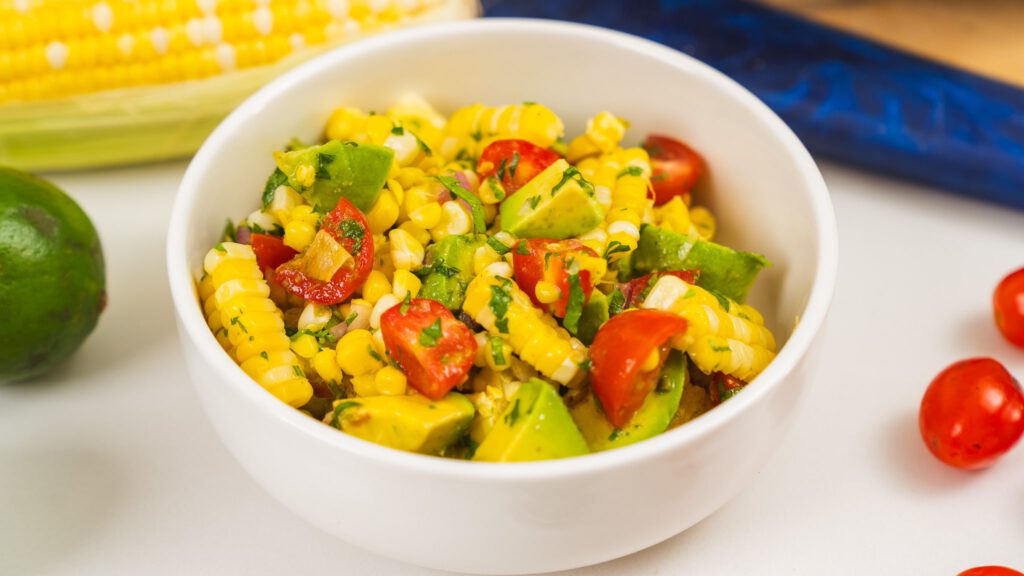 summer corn salad in small white bowl