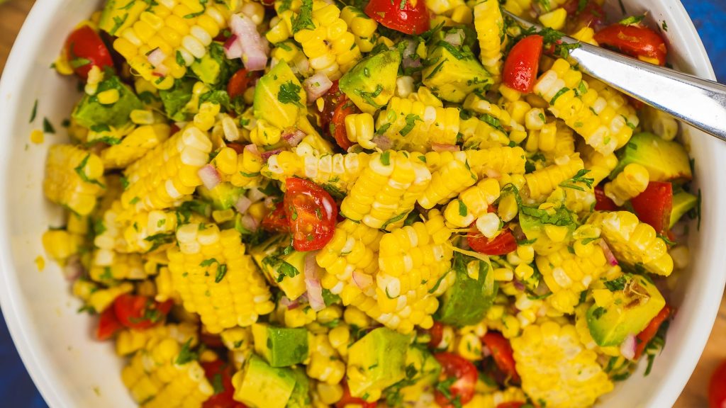 close up of summer corn salad tossed