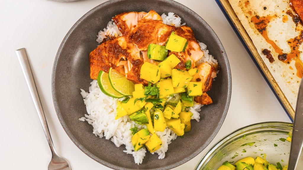 top down view of bbq salmon bowl with mango salad