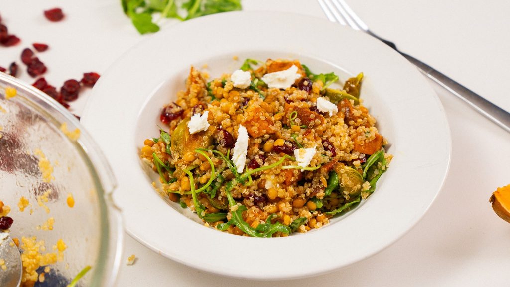 warm harvest grain bowl side angle shot in white bowl
