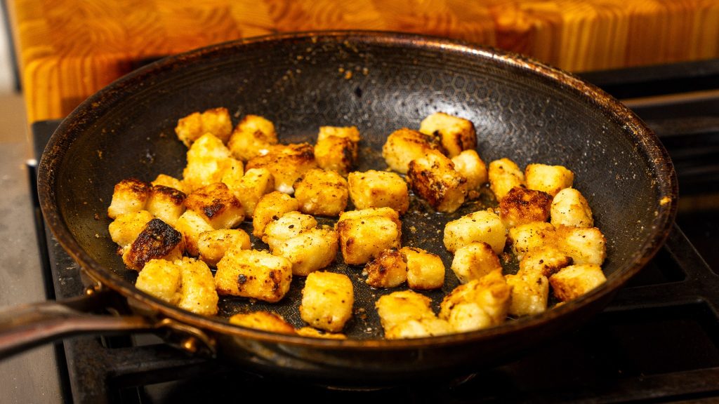 golden brown feta in frying pan