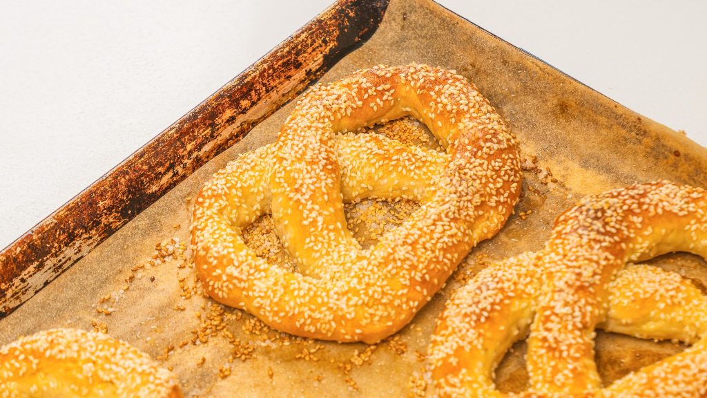 cooked pretzel on a pan lined with parchment paper