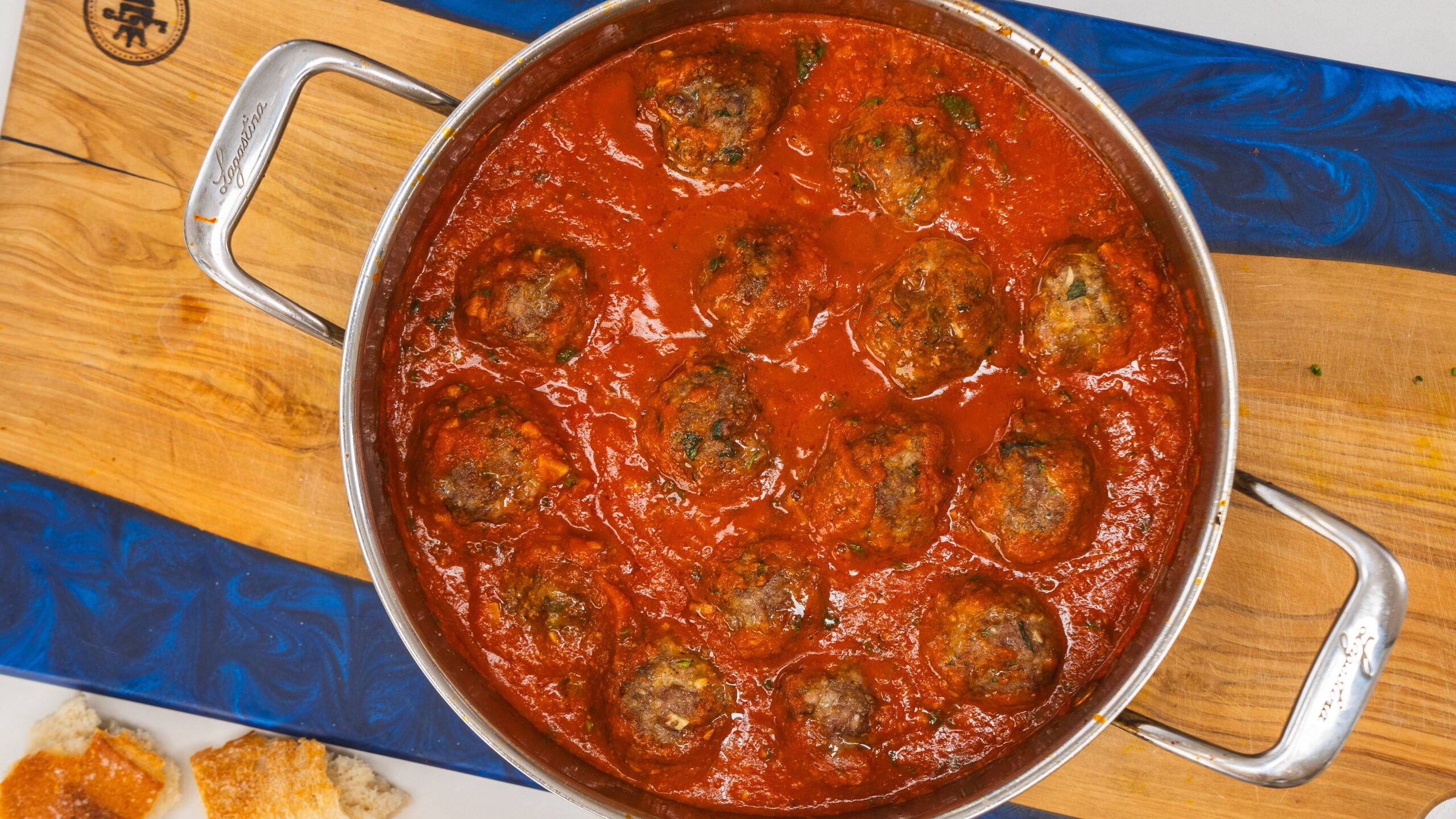 A pan filled with meatballs and tomato sauce. This homemade meatball recipe is bursting with flavor. 