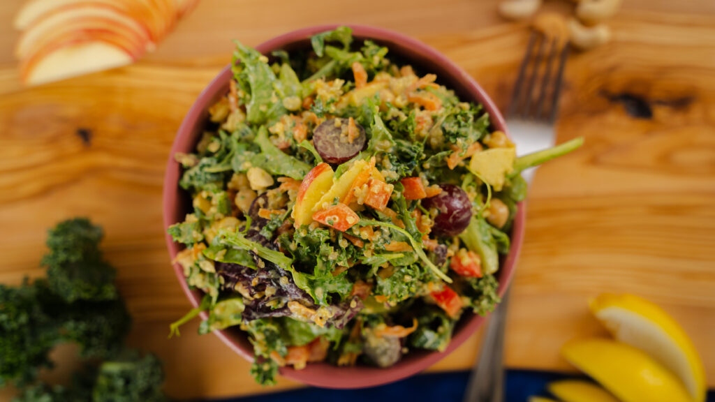 Kale Quinoa Salad in a wooden bowl