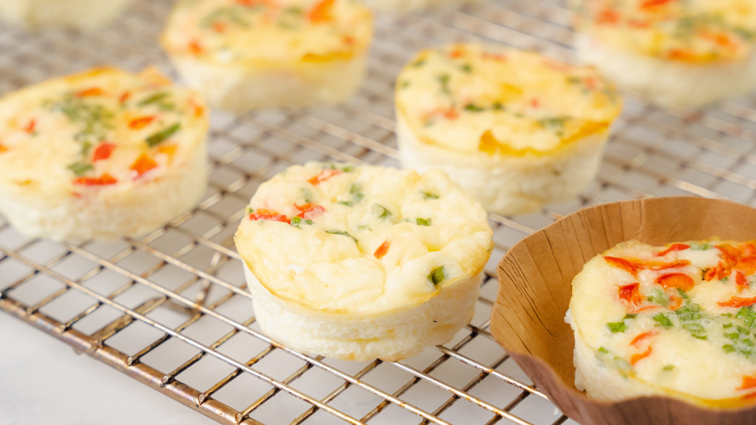 Starbucks egg butes recipe with egg bites sitting on a a cooling wire rack.