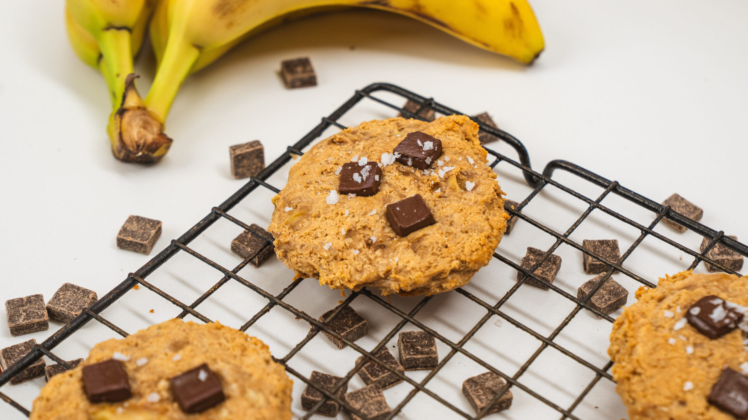 3 ingredient Protein chocolate chip cookies being cooled on a wire rack.