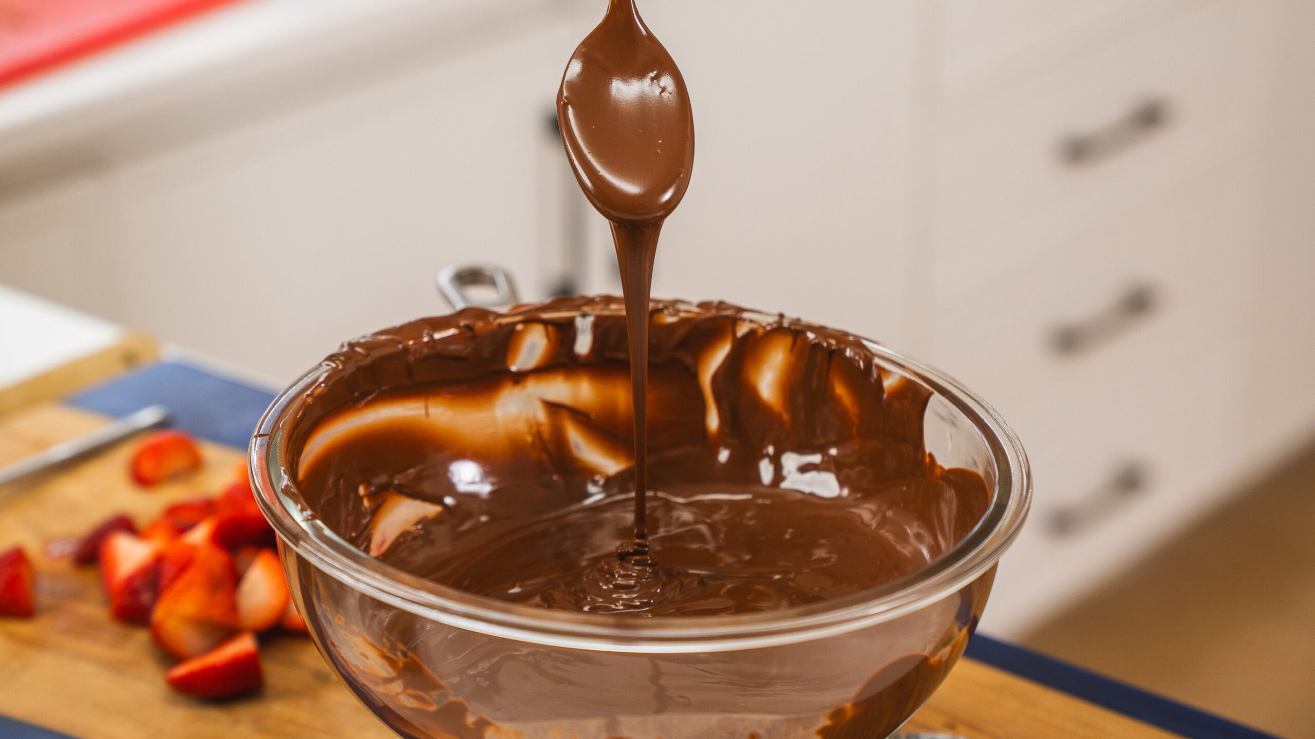 A bowl of melted semi-sweet chocolate.