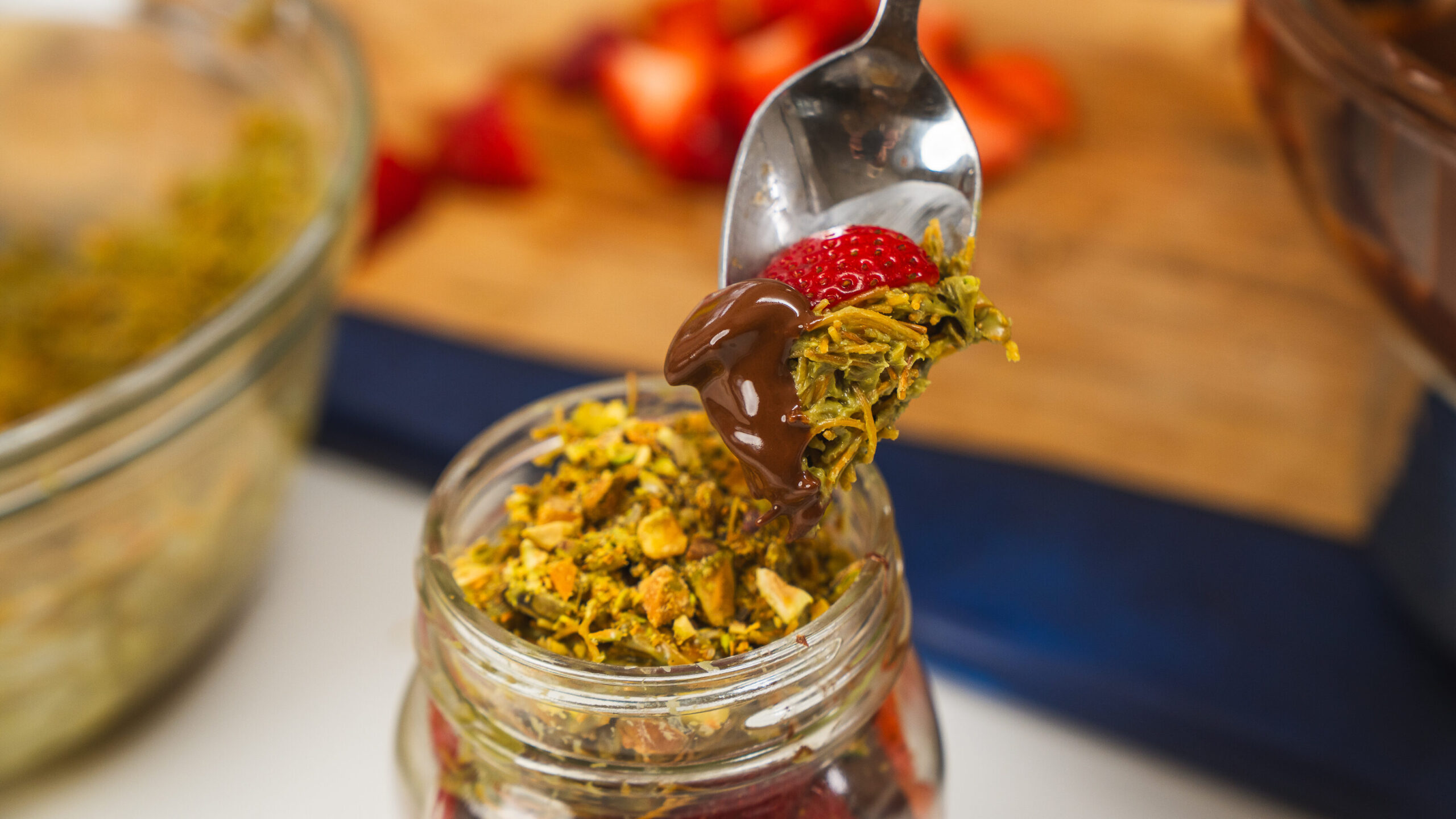 Dubai Chocolate Strawberries layered in a mason jar.
