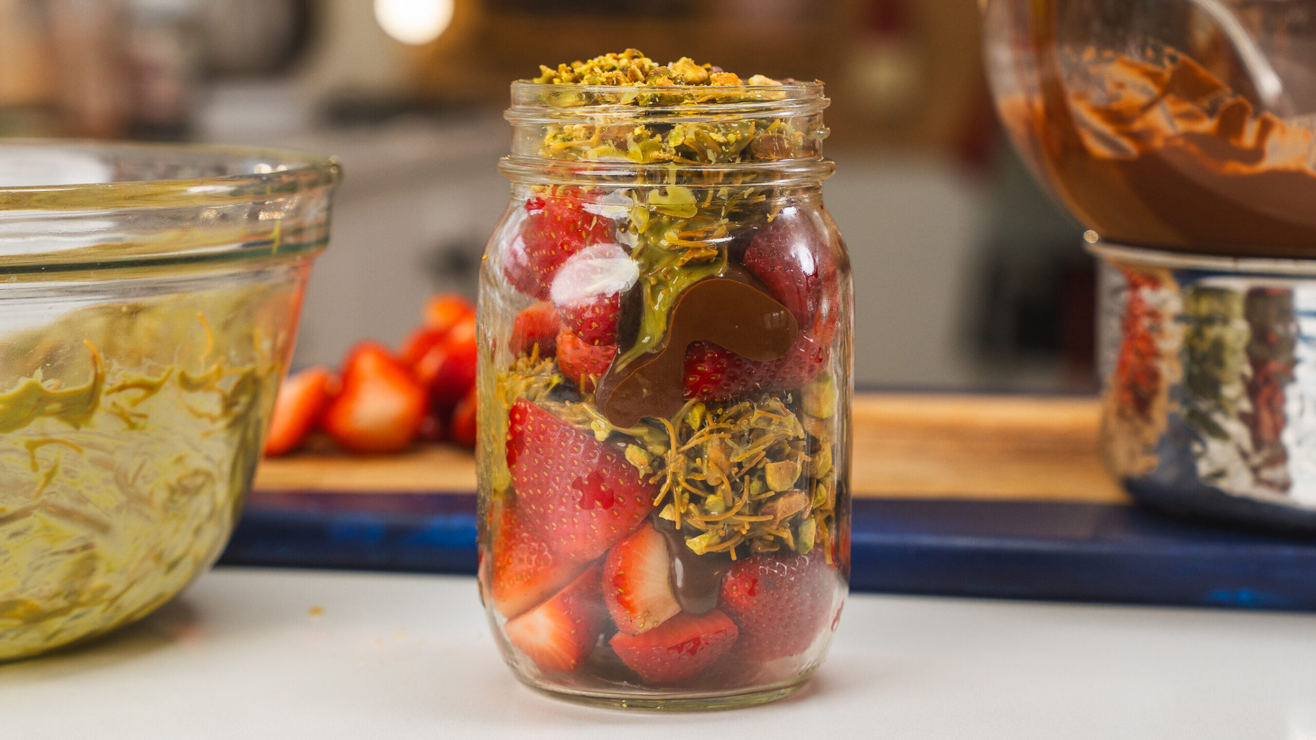 Dubai Chocolate Strawberries layered in a mason jar.