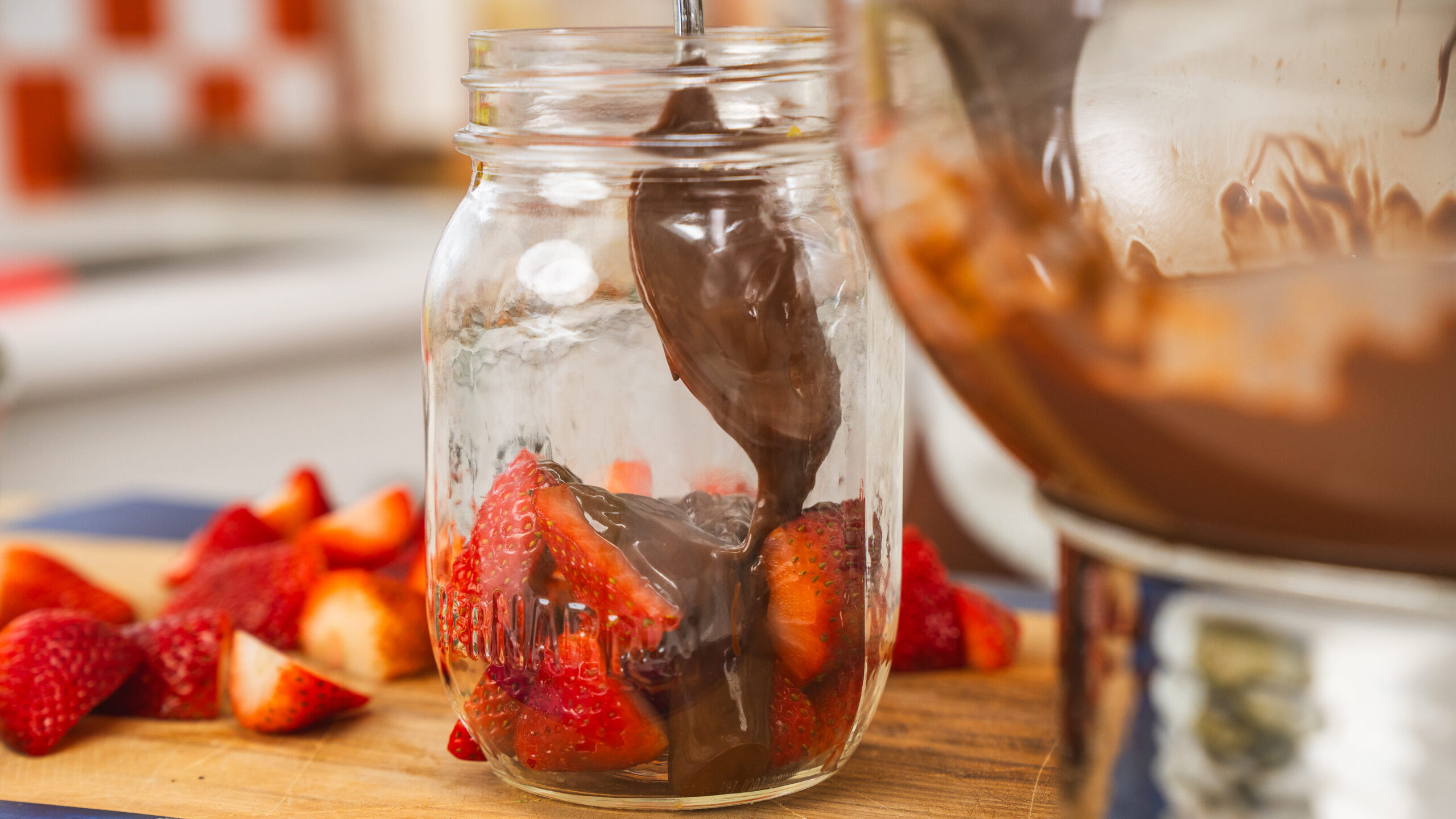 Dubai Chocolate Strawberries layered in a mason jar.