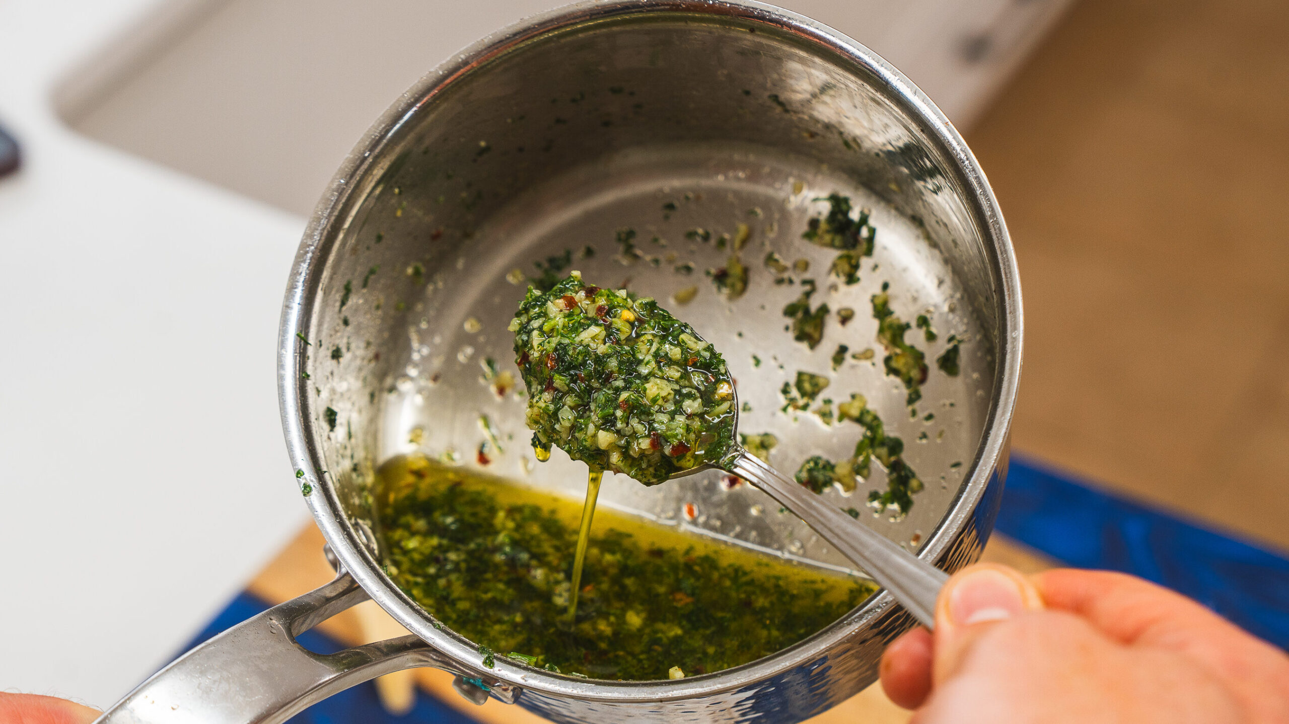 A stainless steel pot of garlic butter for your garlic butter steak bites.