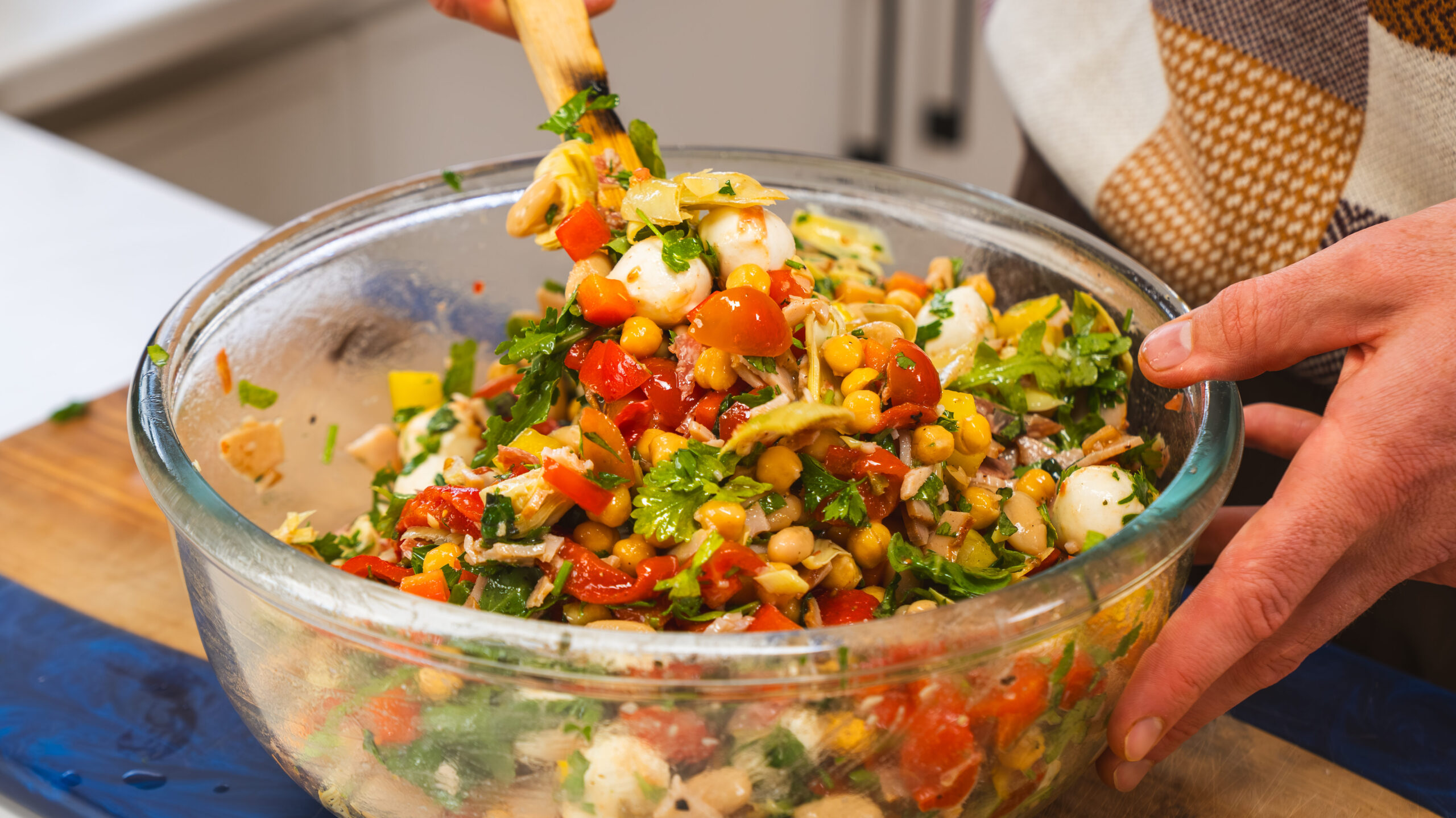Dense bean salad in a large bowl ready for mixing.