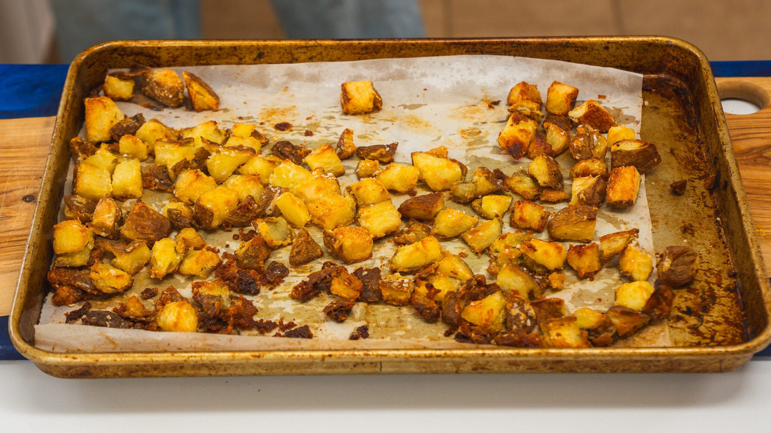Roasted potatoes on a sheet pan for a delicious Patatas Bravas recipe