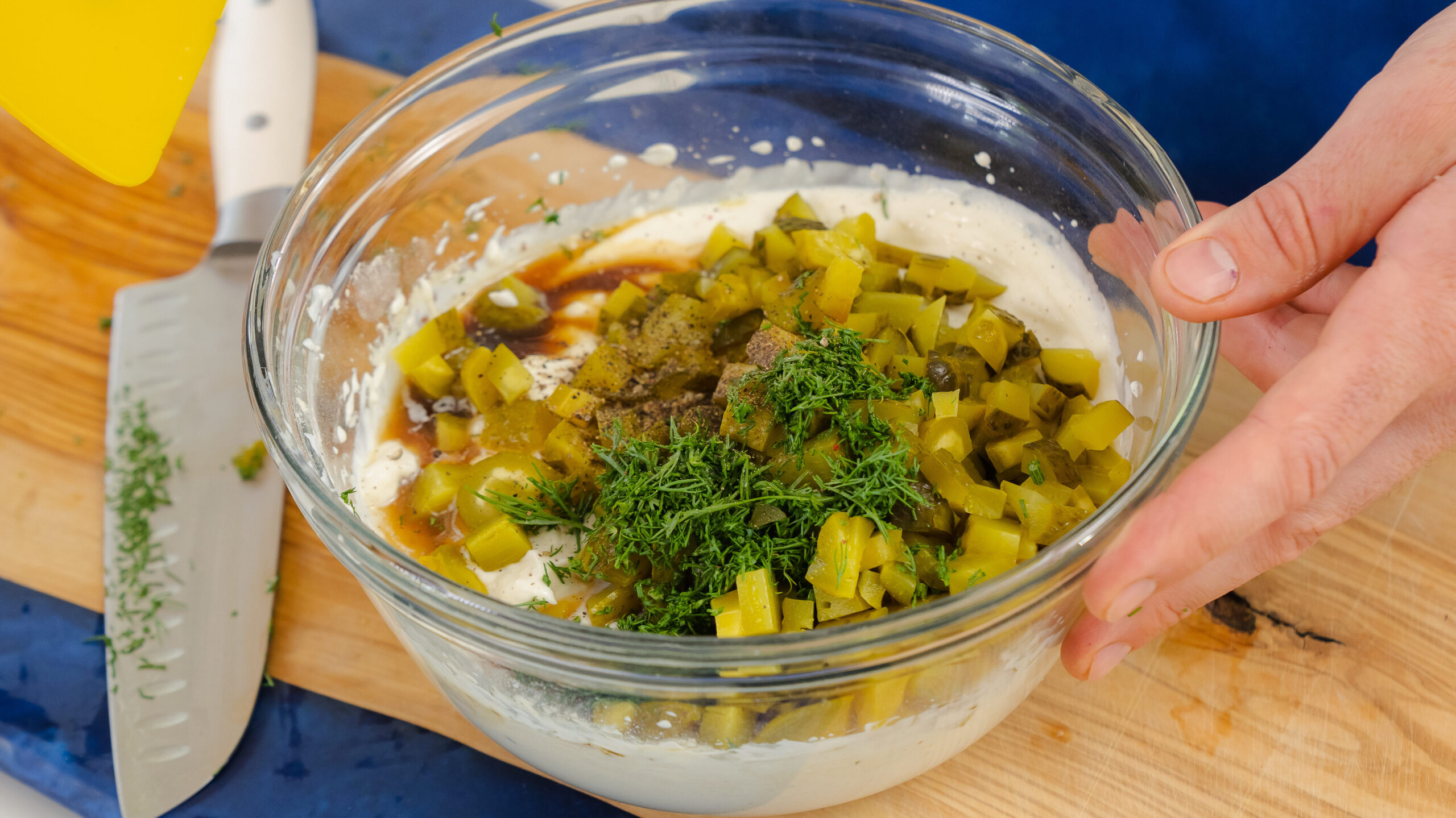 Dill pickle dip ingredients in a bowl.