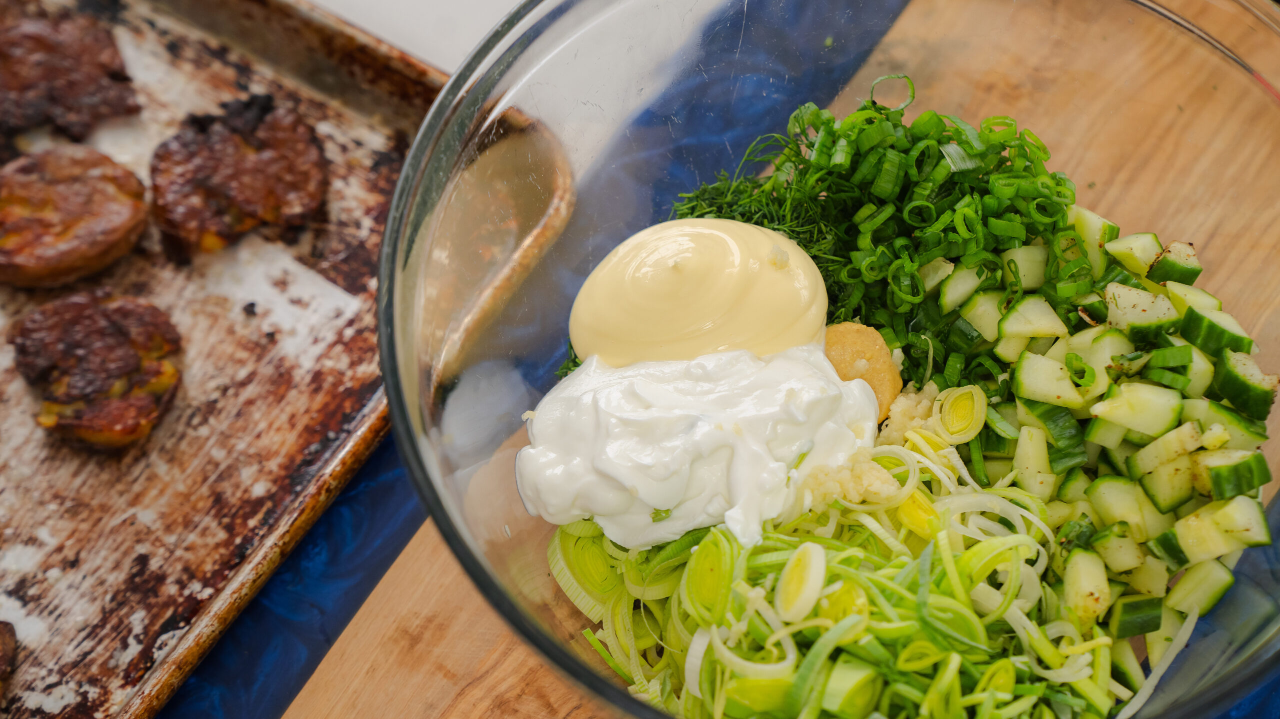 Smashed potato salad dressing ingredients in a bowl.